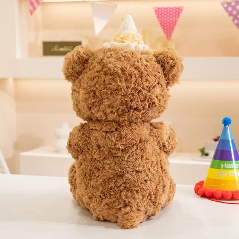 Birthday cupcake plush accessory candle detail in bear arms close up product photo