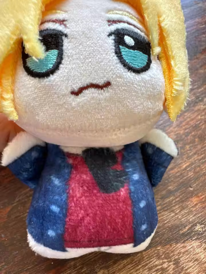 Eiji Okumura and Ash Lynx plush side by side display anime shelf collectible