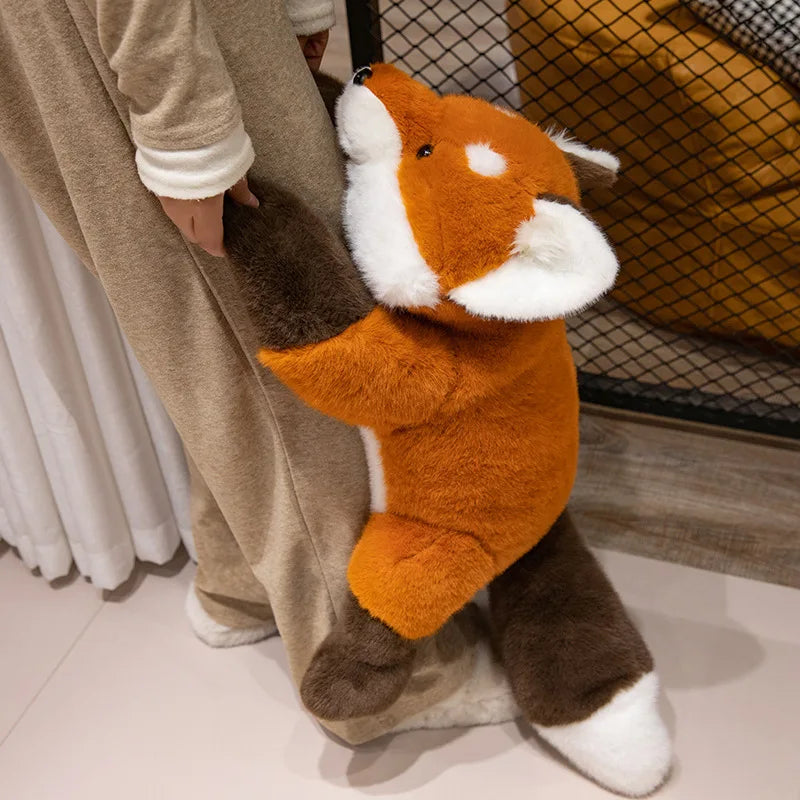 Huge 65cm fox plush being held by a child for scale