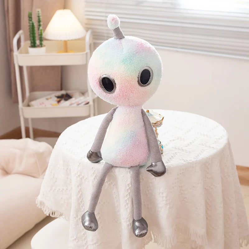 Kawaii space girl plush green alien on desk as cute bedroom decor