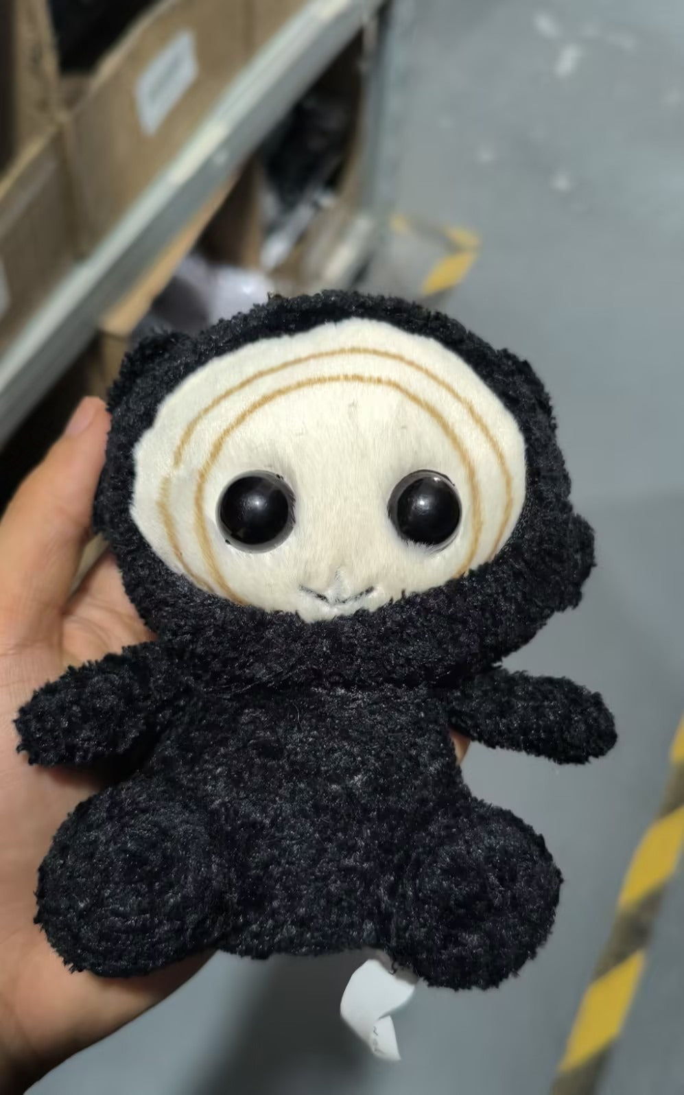 Kkeomeoksali_handmade_plush_angled_view_showing_rounded_silhouette_and_velvety_black_fabric_supplier_photo