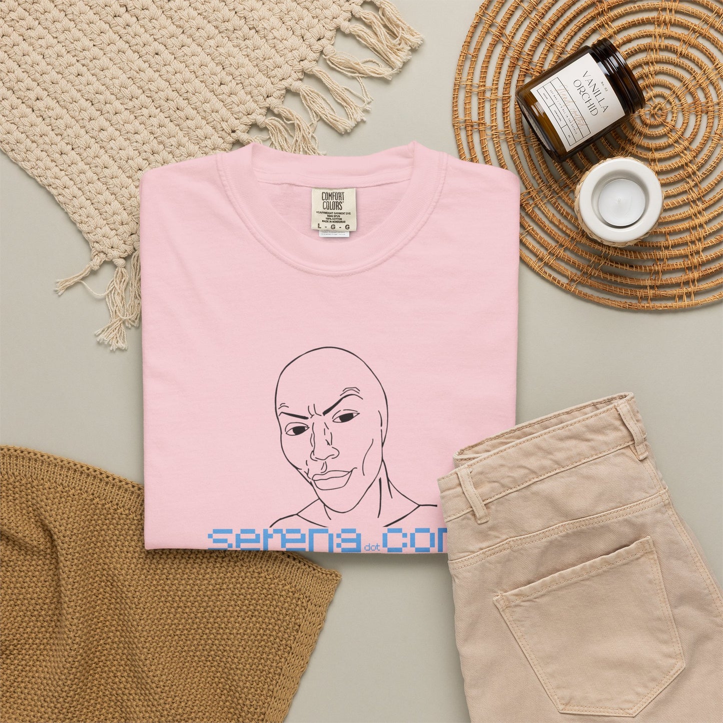 Minimalist face design shirt worn on model casual studio shot neutral background