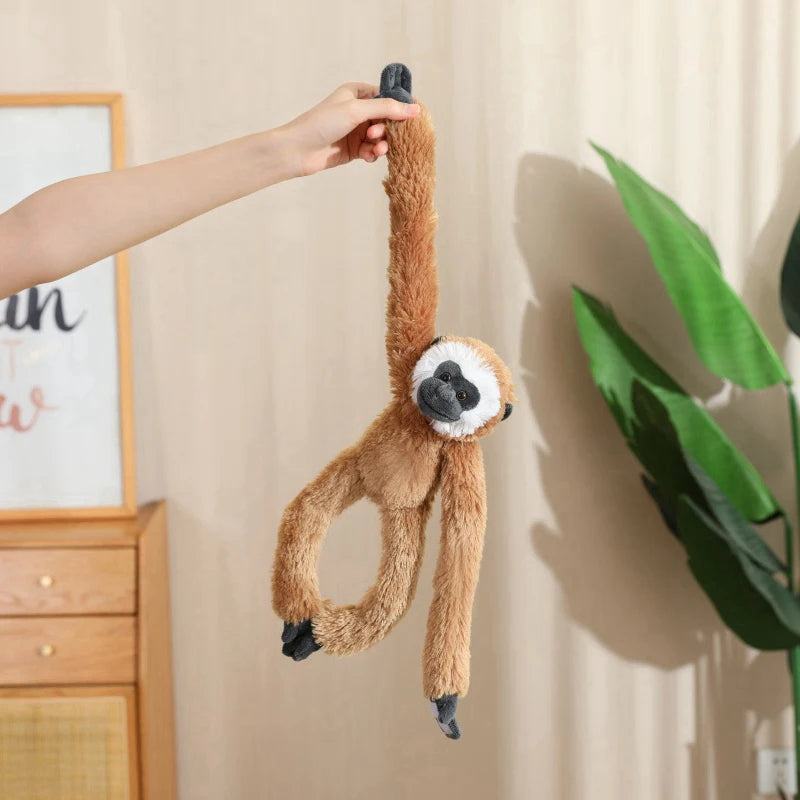 Monkey and sloth plushie collection flat lay showing all size variants 50cm and 70cm