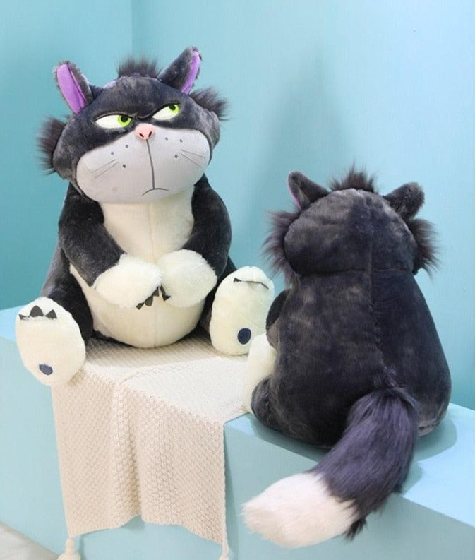Cat plushie giving bombastic side eye - excellent as a snuggly pillow.