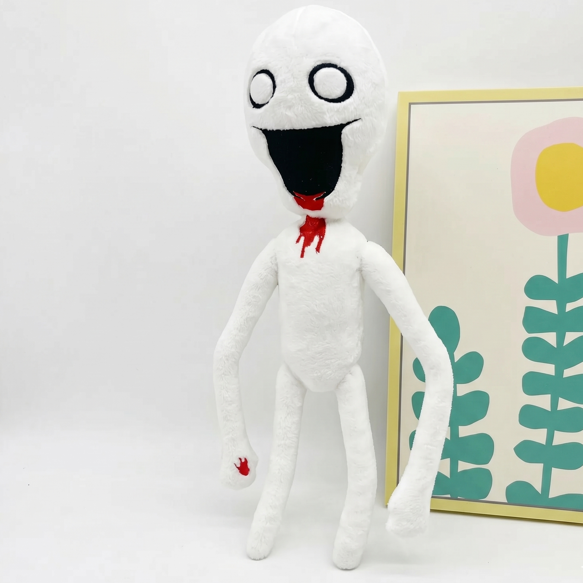 096 plush side profile elongated limbs pale plush fabric close-up detail
