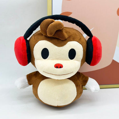 22cm BOMBANANA plush toy sitting on gaming desk
