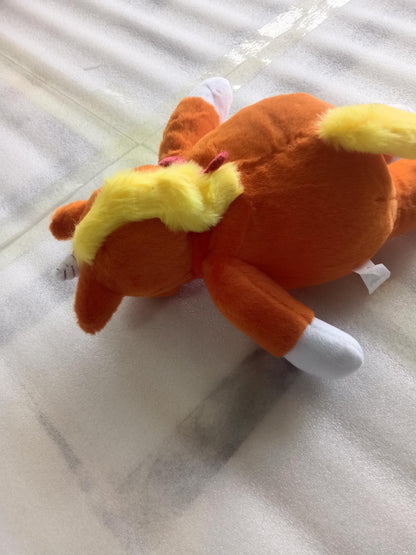 25cm_Buddy_the_Unicorn_horror_plush_sitting_on_a_collector_s_shelf_next_to_other_cult_horror_movie_merchandise_supplier_photo.