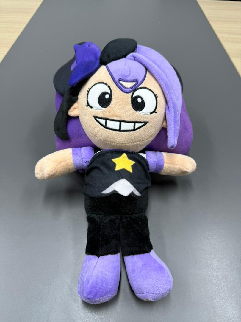 25cm Lily plush toy in a seated position showing the detailed star logo on her outfit.
