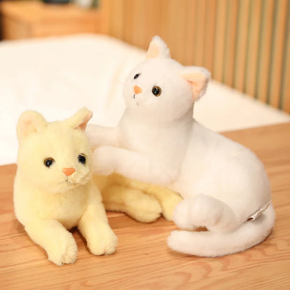 30cm fluffy cat stuffed toy in black sitting in a cozy home setting