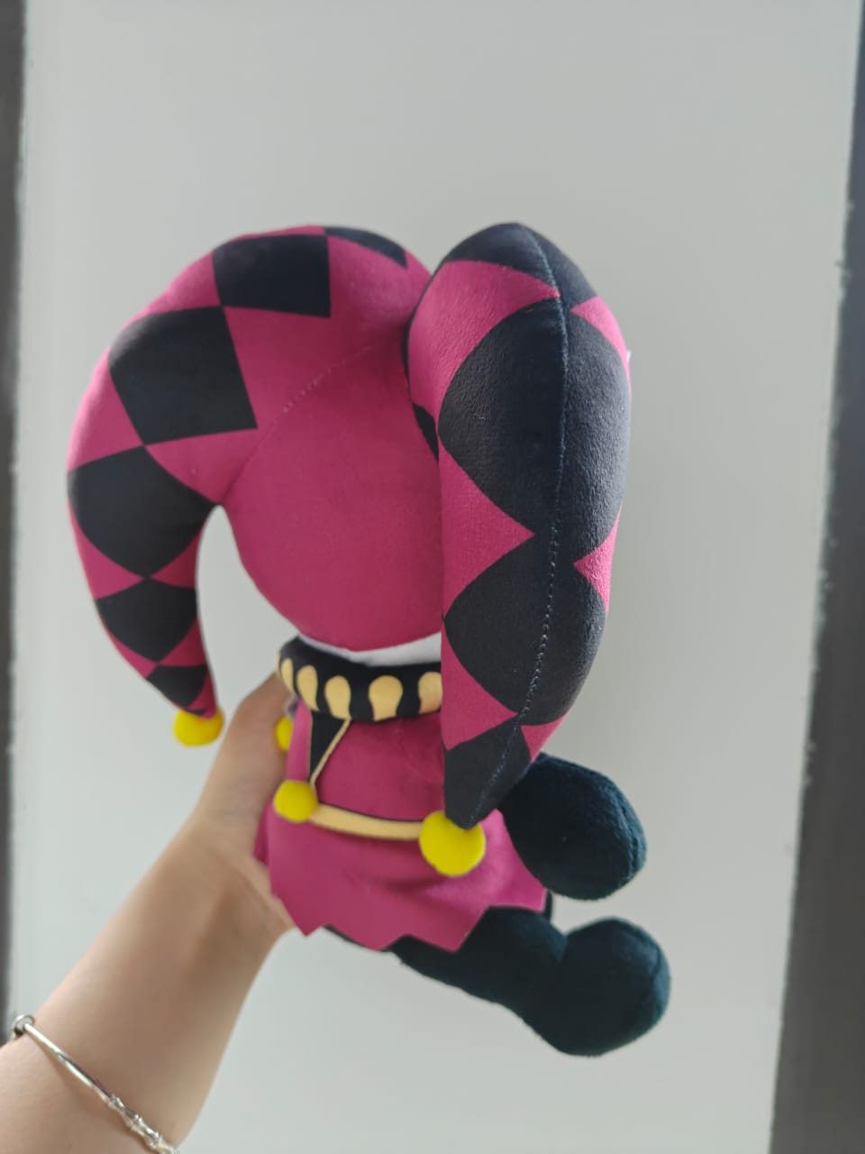 A 25cm handmade jester plush toy featuring a classic harlequin and pierrot design, inspired by circus horror visual novels, displayed against a stark white background.