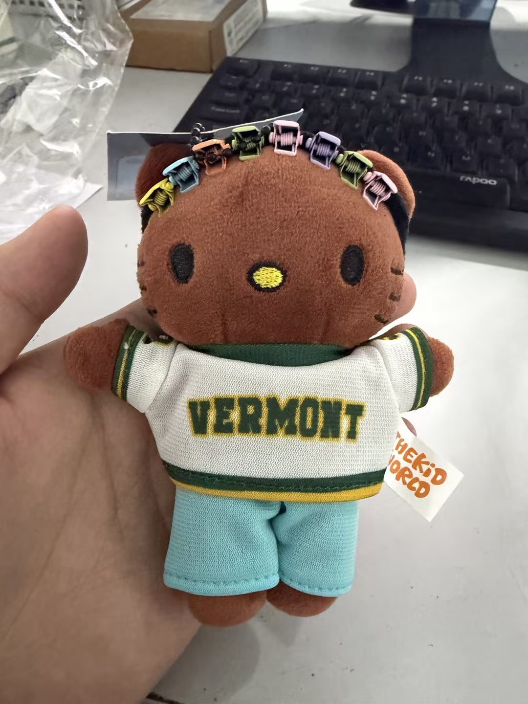 A close-up view of the 13cm handmade hip-hop icon plush keychain showing its detailed handcrafted features and soft textured fabric.