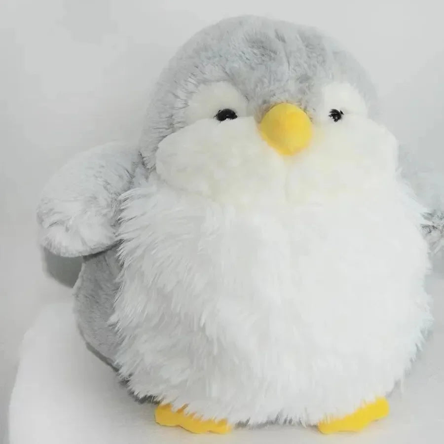 A fluffy 20cm penguin stuffed toy highlighting its torpedo-shaped body and round belly.