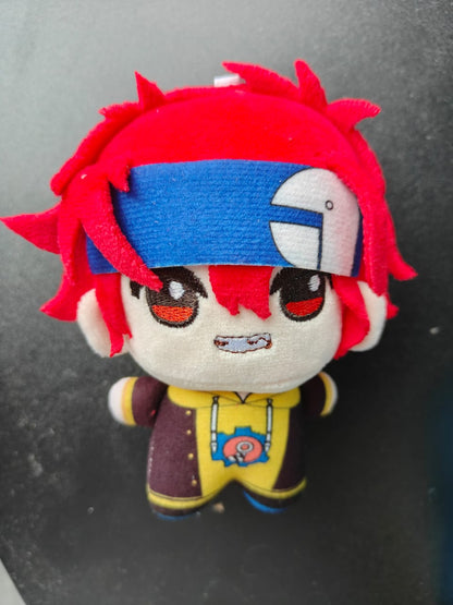 A plush toy attached securely to a backpack as a portable bag charm.
