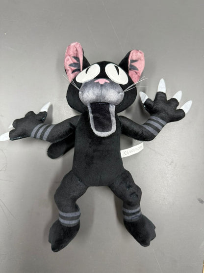 Aesthetic black cat plushie for shelf display and cuddling.