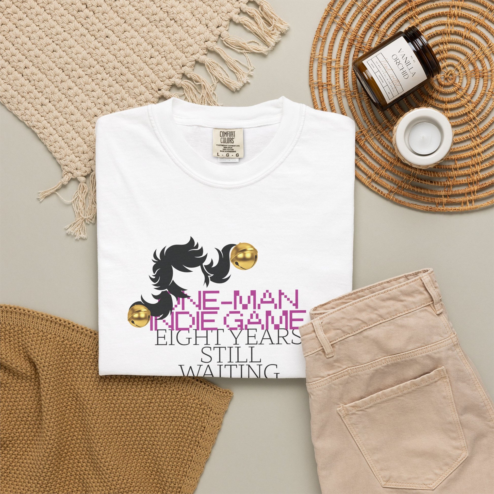 Aesthetic streetwear tee flat lay styled with retro gaming props
