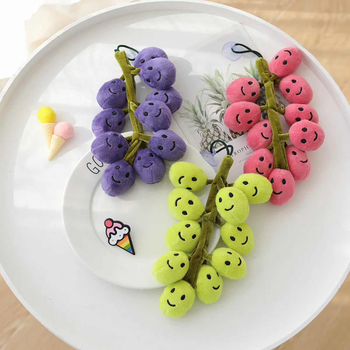 All six variants of smiling grapes plush: S and L sizes in black, red, and green