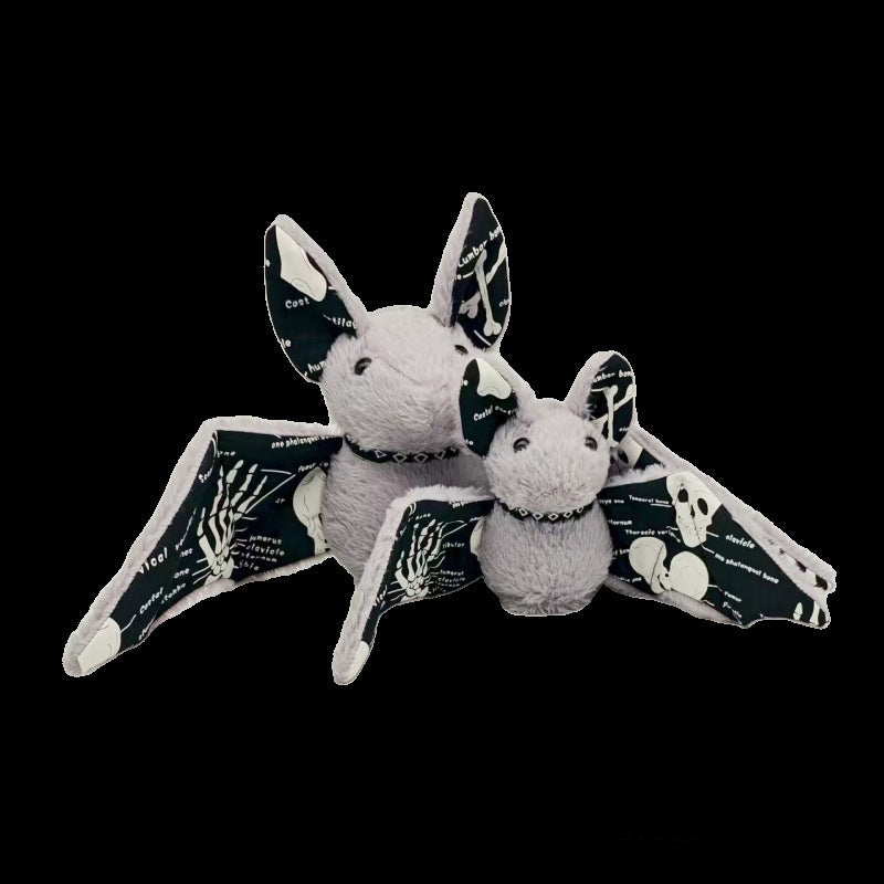 Anatomical bat toy with skeleton wing print glowing in low light