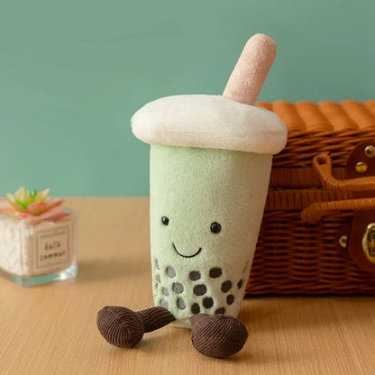 Anime plush toy kawaii boba plushie on desk surrounded by kawaii themed accessories