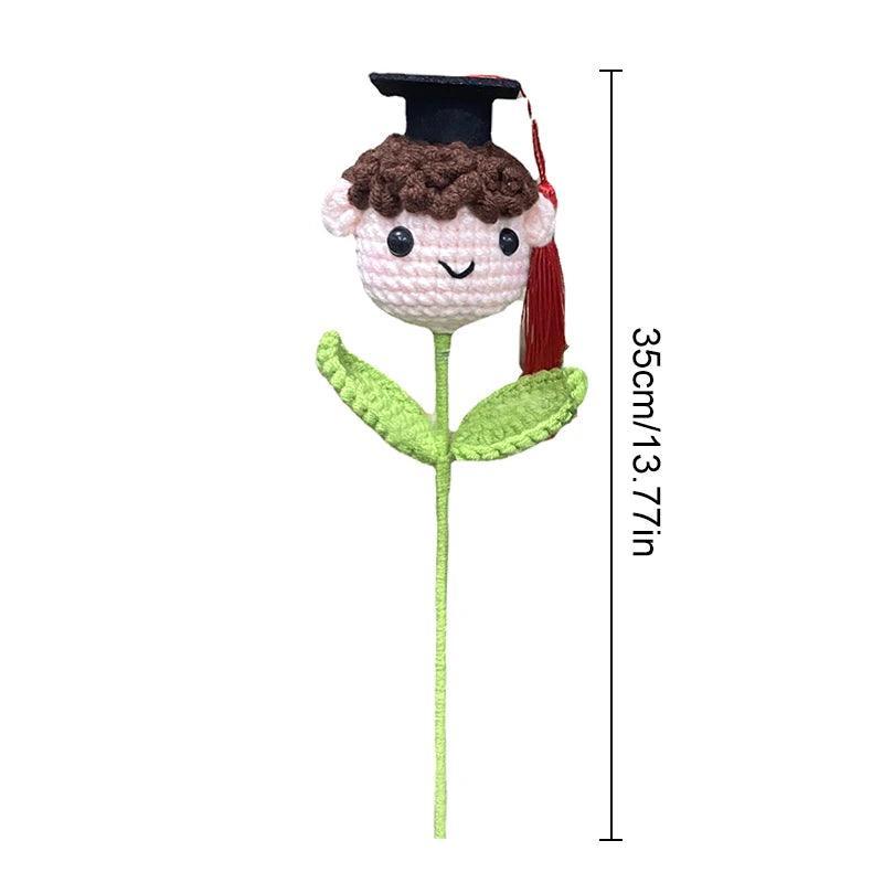 Aprasi handmade graduation gift crochet doll close-up detail of graduation cap
