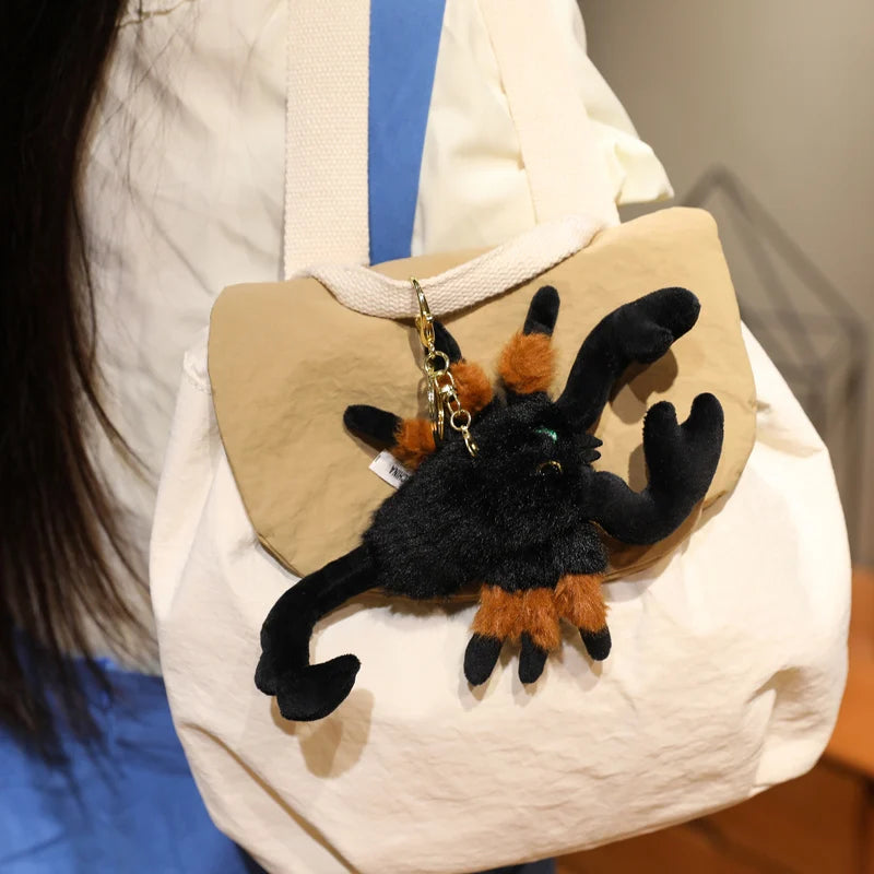Arachnid plush gift scorpion stuffed animal in gift wrapping with Halloween ribbon