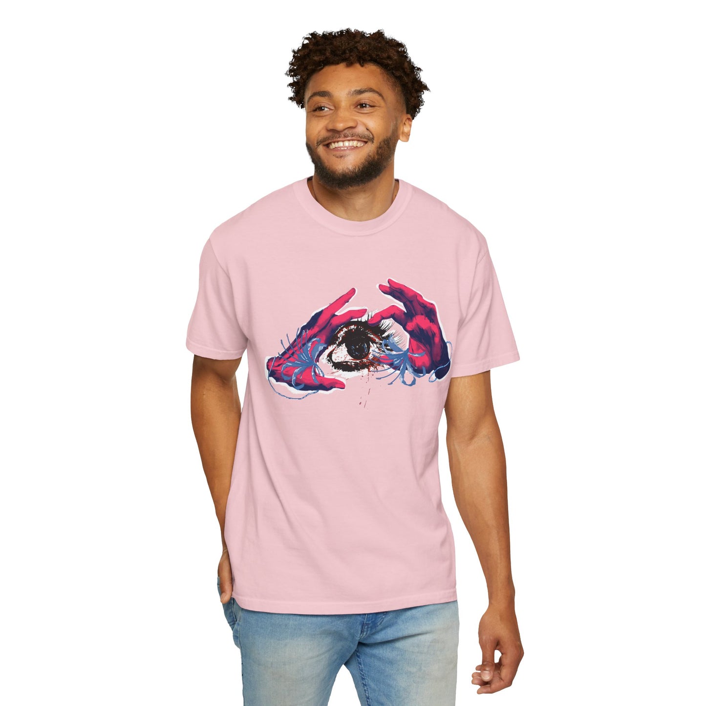 Artistic eye graphic tee hanging on wooden hanger against dark studio background