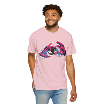 Artistic eye graphic tee hanging on wooden hanger against dark studio background