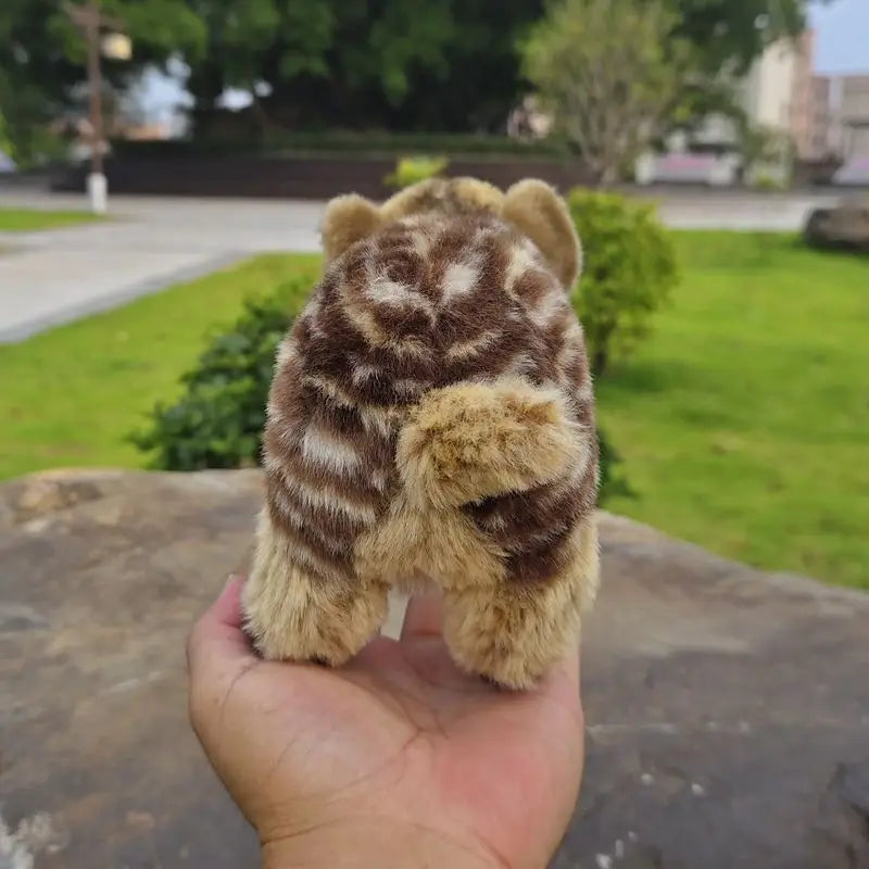 Baby boar plush toy size scale held in adult palm showing 11cm reference