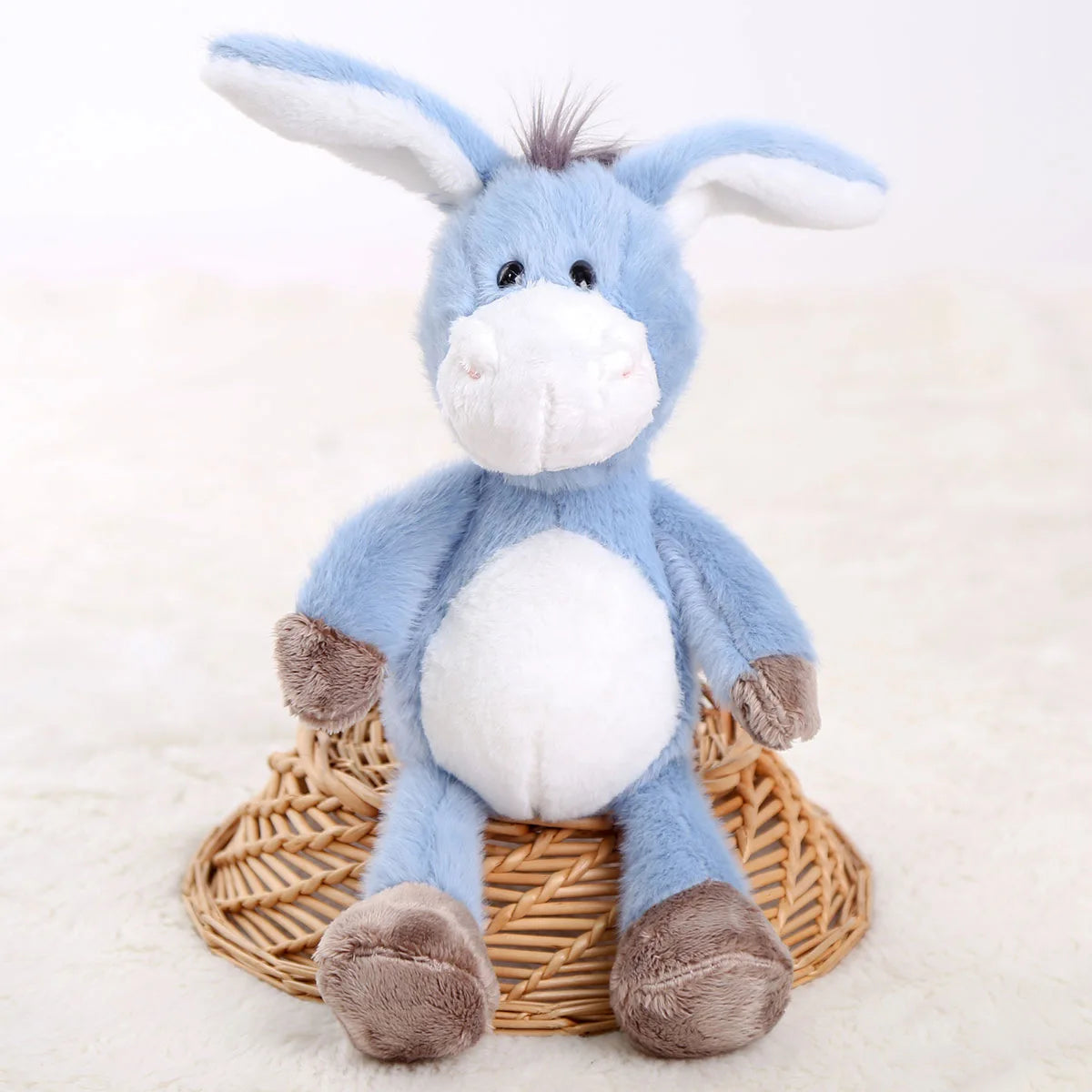Baby donkey toy gift wrapped with ribbon for a baby shower