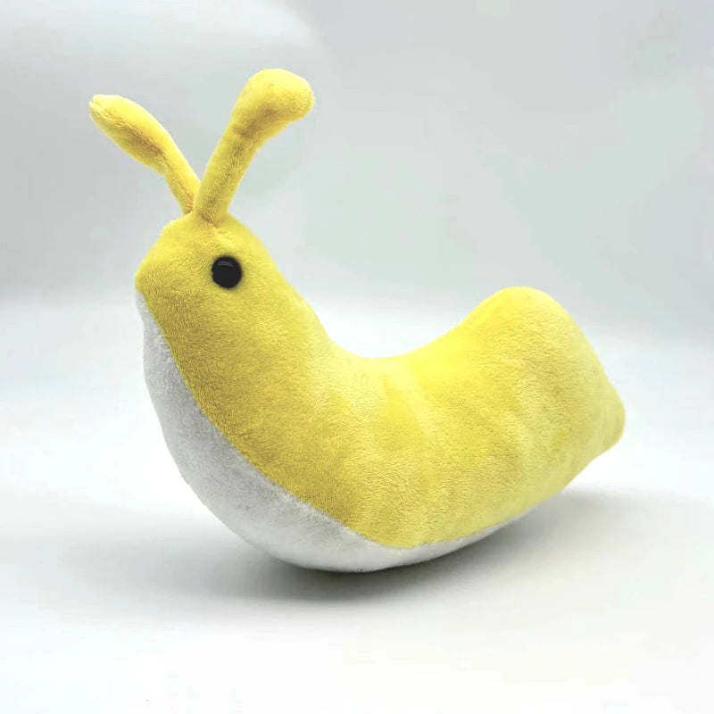 Banana slug plush toy in hand for scale 20cm size reference
