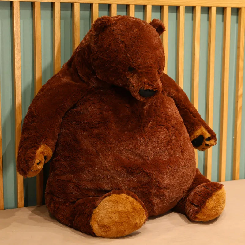 Big round bear plush toy from above showing full circular belly and proportional stubby limbs