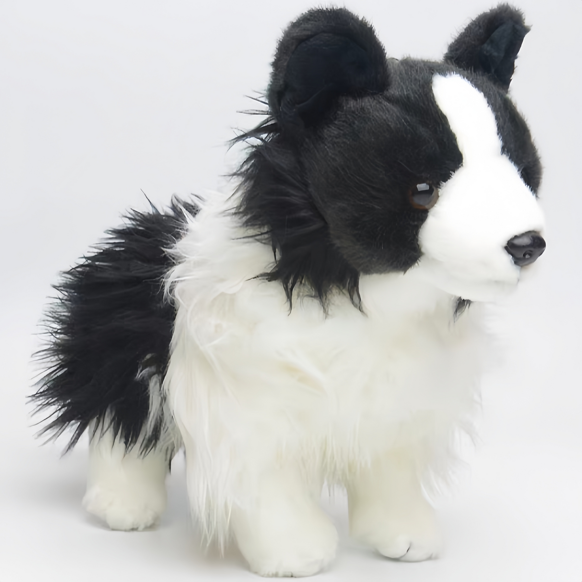 Black and white dog plush border collie fur texture detail
