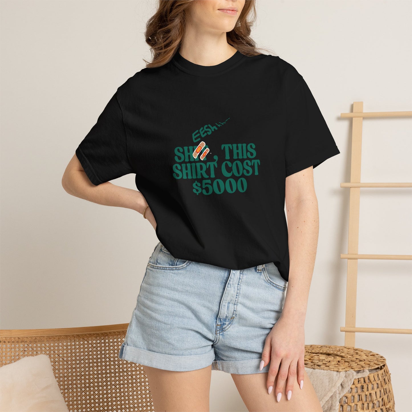 Black garment-dyed t-shirt with statement typographic graphic, front flat lay