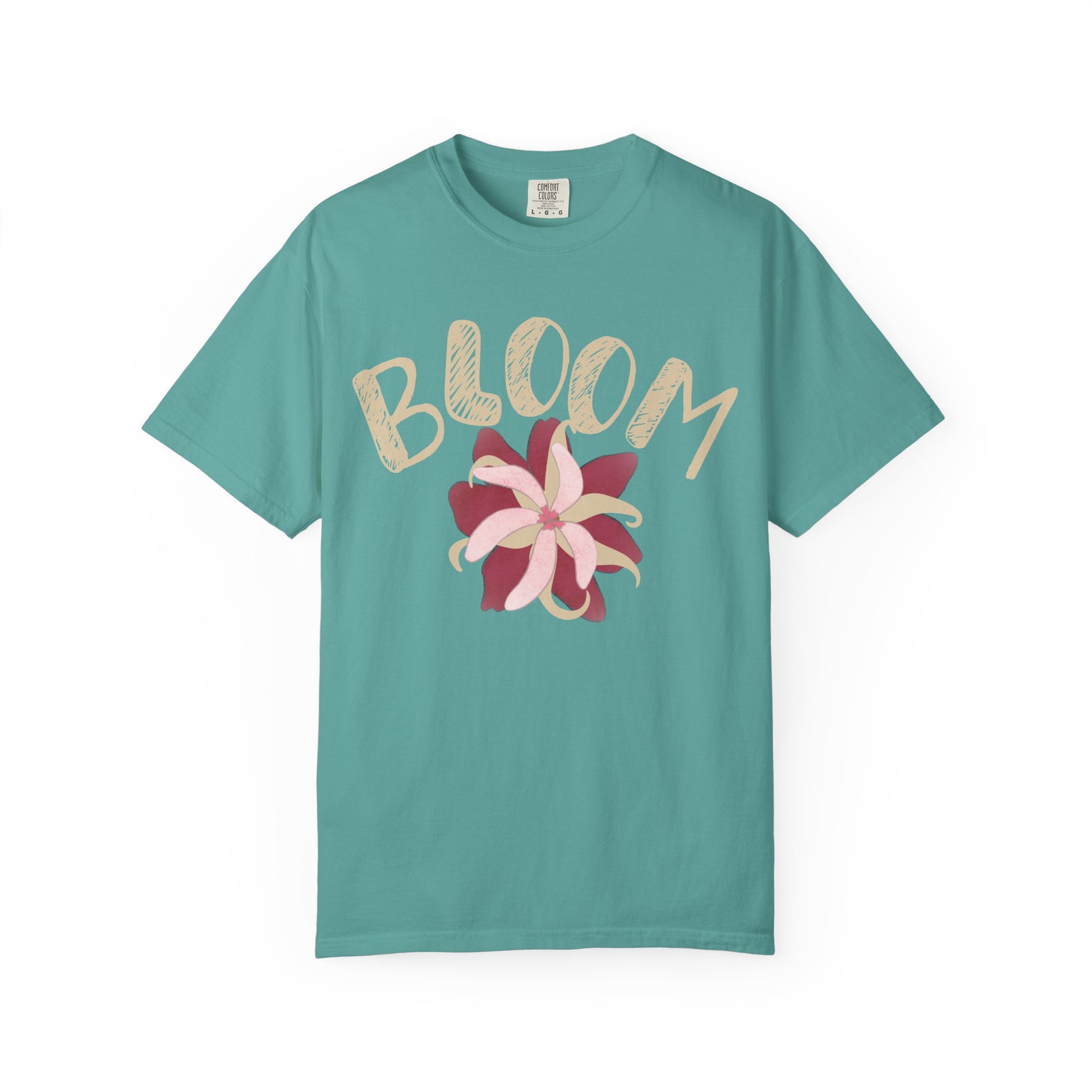 Bloom graphic tee on model, relaxed unisex fit in soft garment-dyed blush pink