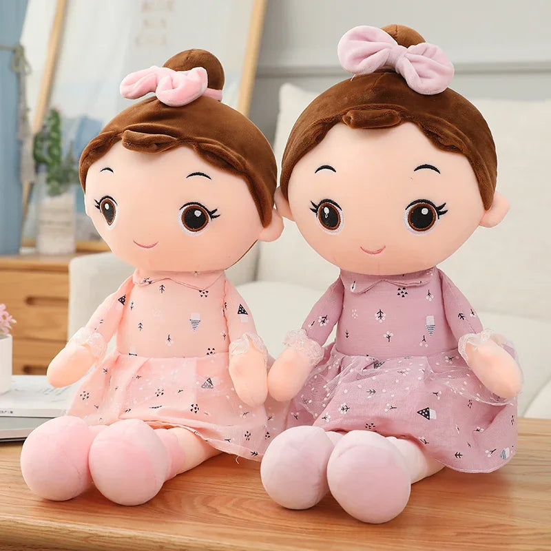 Blush pink soft princess rag doll close up of embroidered face and plush fabric detail