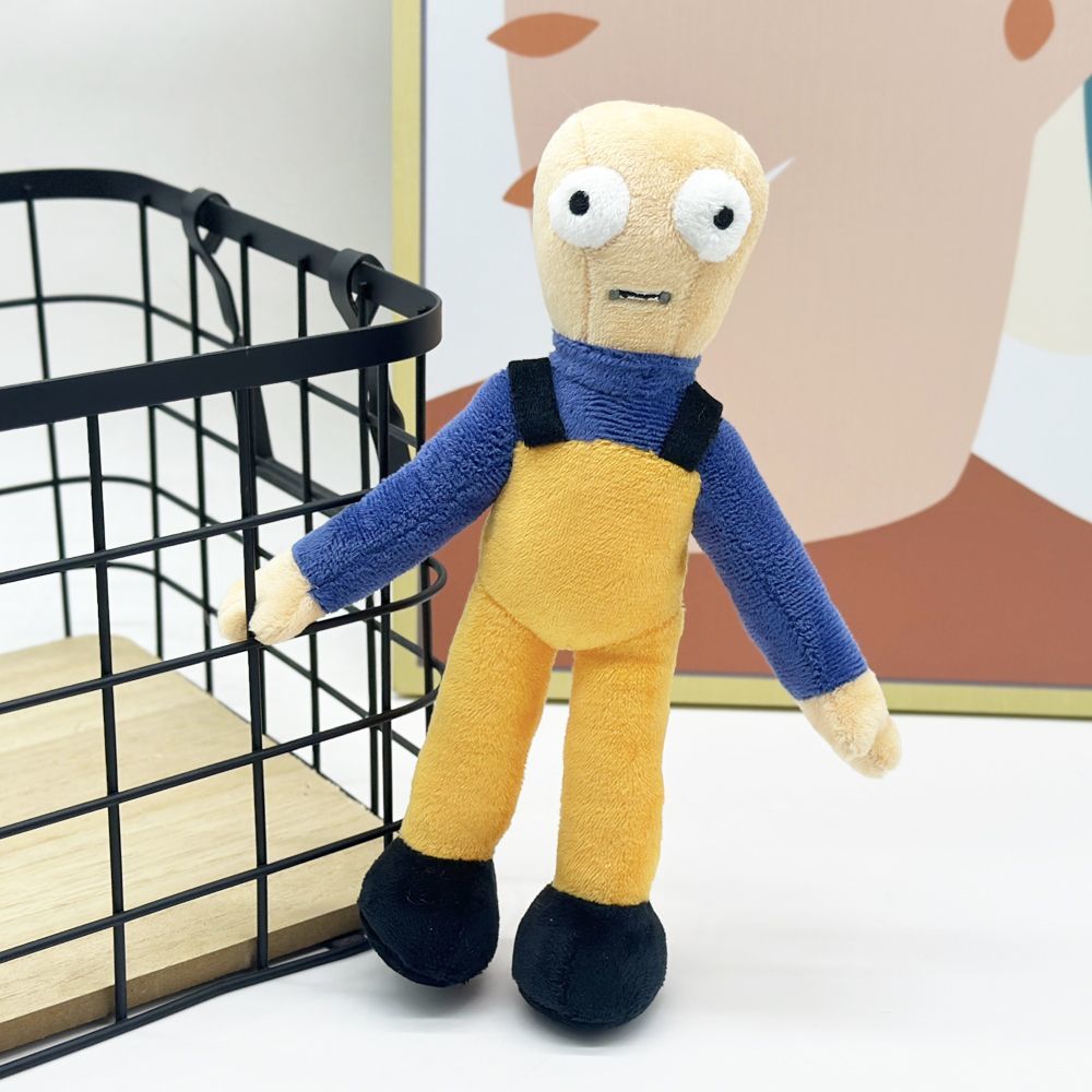 Bob plush toy sitting on gaming desk beside controller for scale