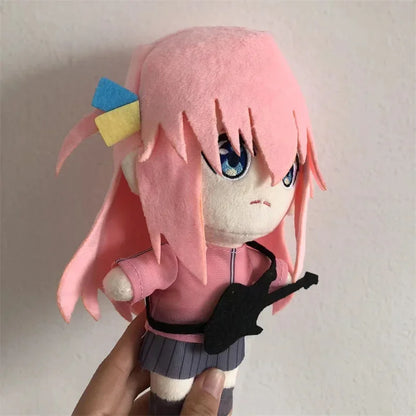 Bocchi plushie with guitar on display shelf anime room decor