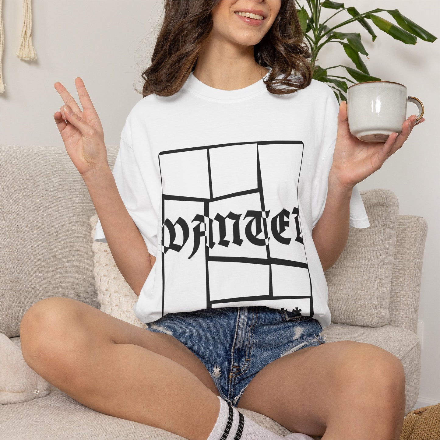 Bold WANTED graphic tee with fractured block framing on navy cotton