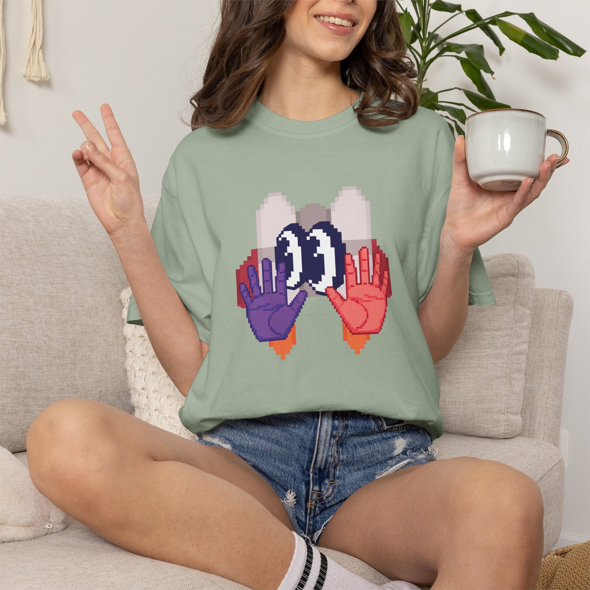 Boxy fit cotton tee digital surrealism print hanging white wall product shot
