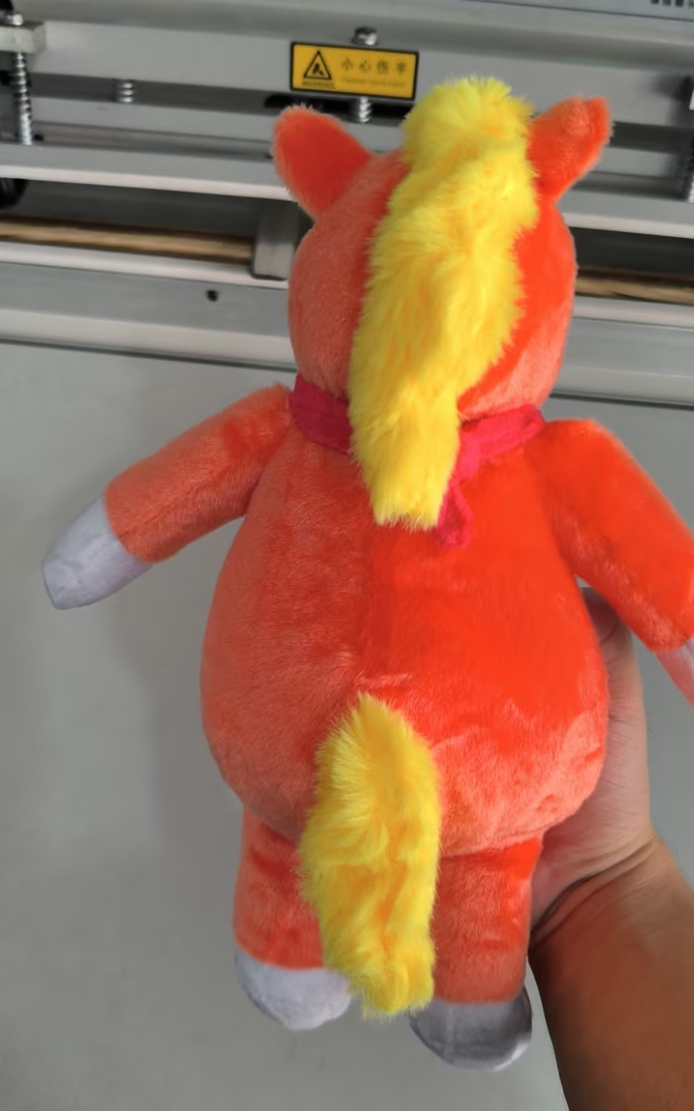 Buddy_plush_orange_unicorn_stuffed_animal_from_indie_horror_film_supplier_photo