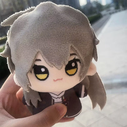 Caelus plush displayed on desk beside gaming setup
