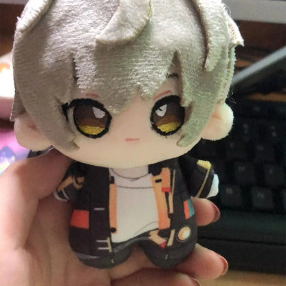Caelus plush displayed on desk beside gaming setup
