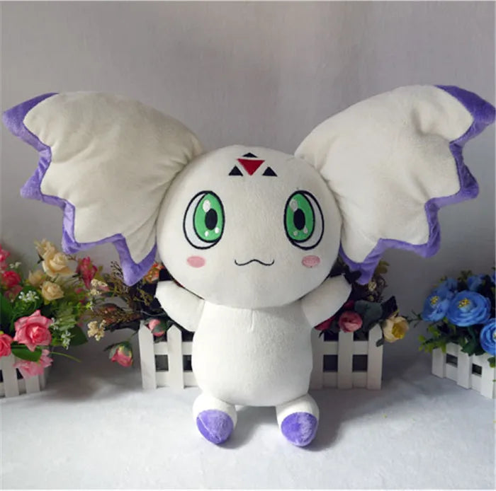 Calumon plush sitting pose showing triangular ear flaps
