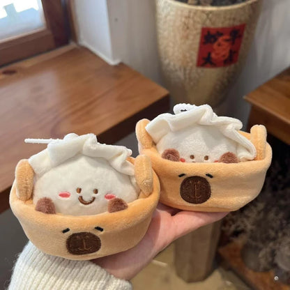 Capybara collectible bamboo steamer basket pouch open showing hidden dumpling plush