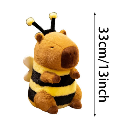 Capybara meme plush in bee costume sitting on a desk as a kawaii companion piece next to a keyboard
