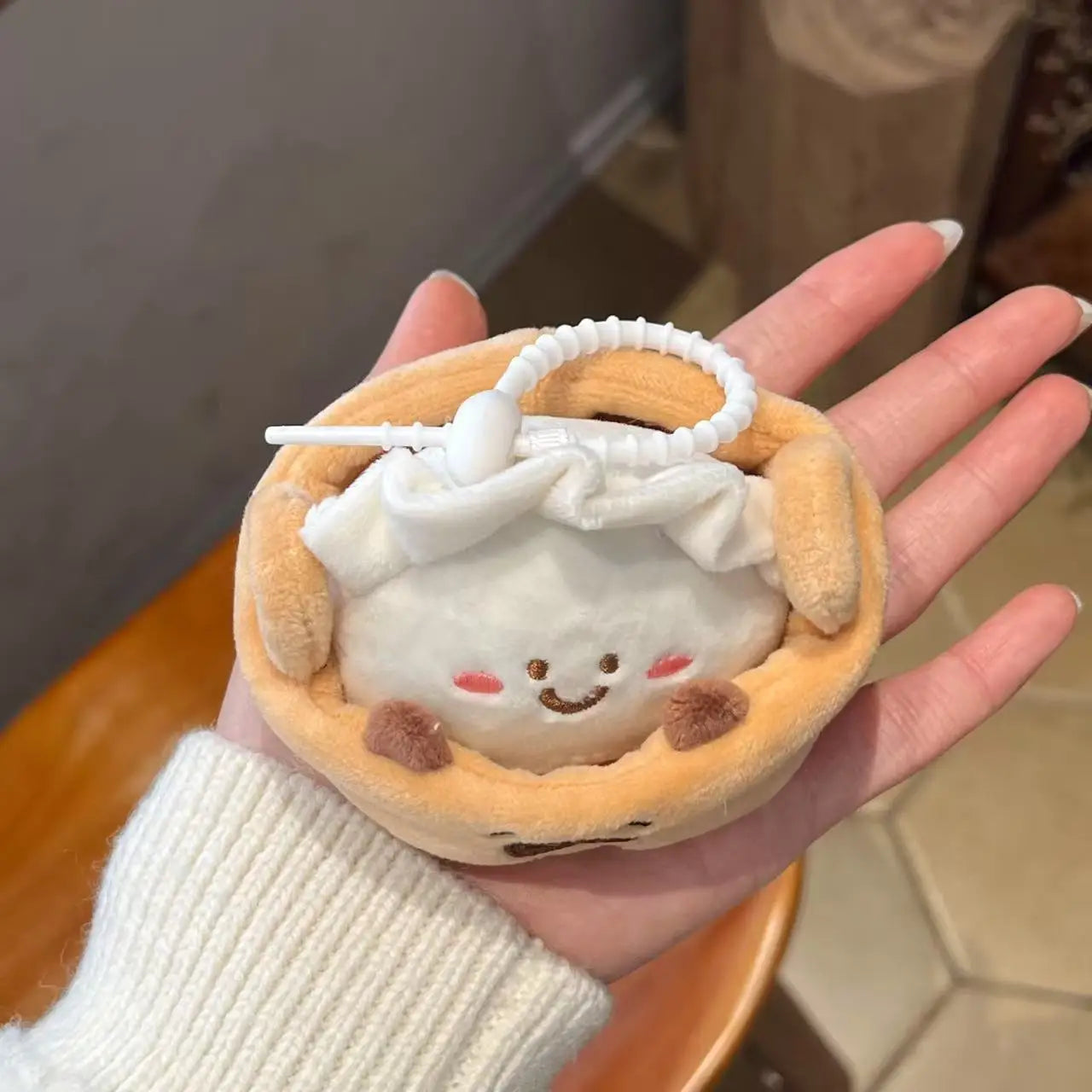 Capybara merch kawaii keychain set displayed on wooden shelf with plants
