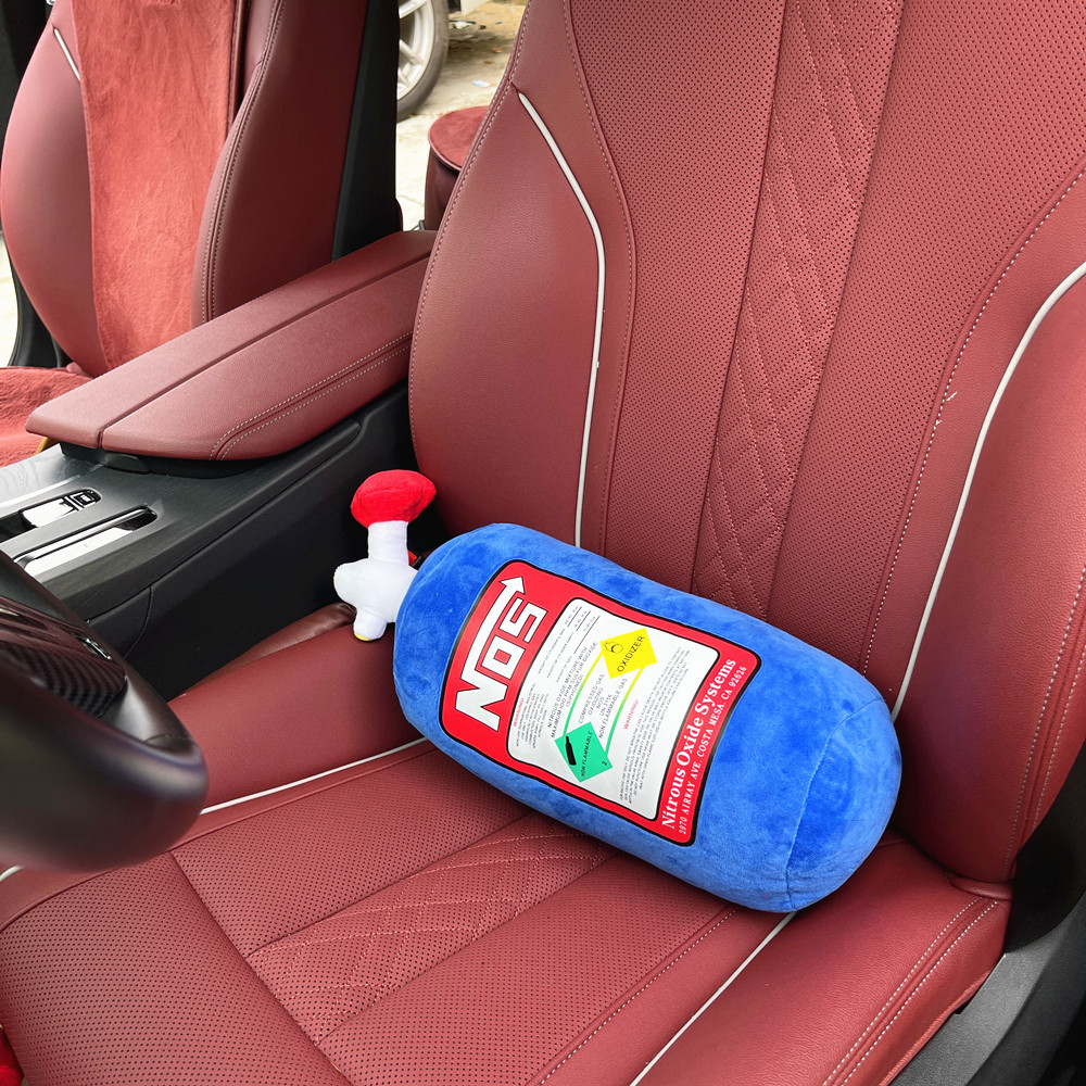 Car neck pillow shaped like a nitrous oxide canister in racing blue
