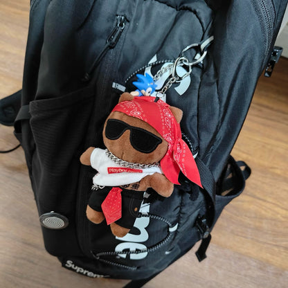 Carti keychain attached to backpack zipper streetwear accessory
