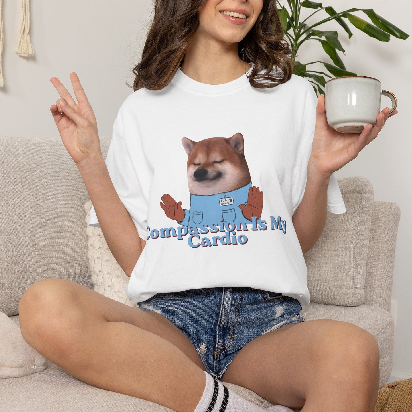 Casual graphic tee with dog drawing and Compassion Is My Cardio text