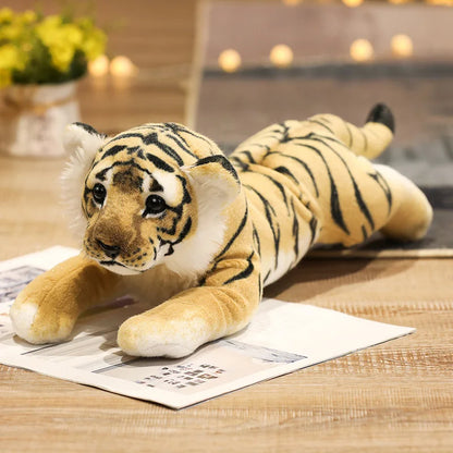 Child holding a large realistic tiger cub stuffed animal as a hugging plush pillow