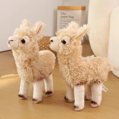Child holding alpaca plush toy showing huggable 30cm size
